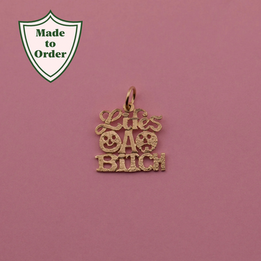 'Life's a Bitch' Charm