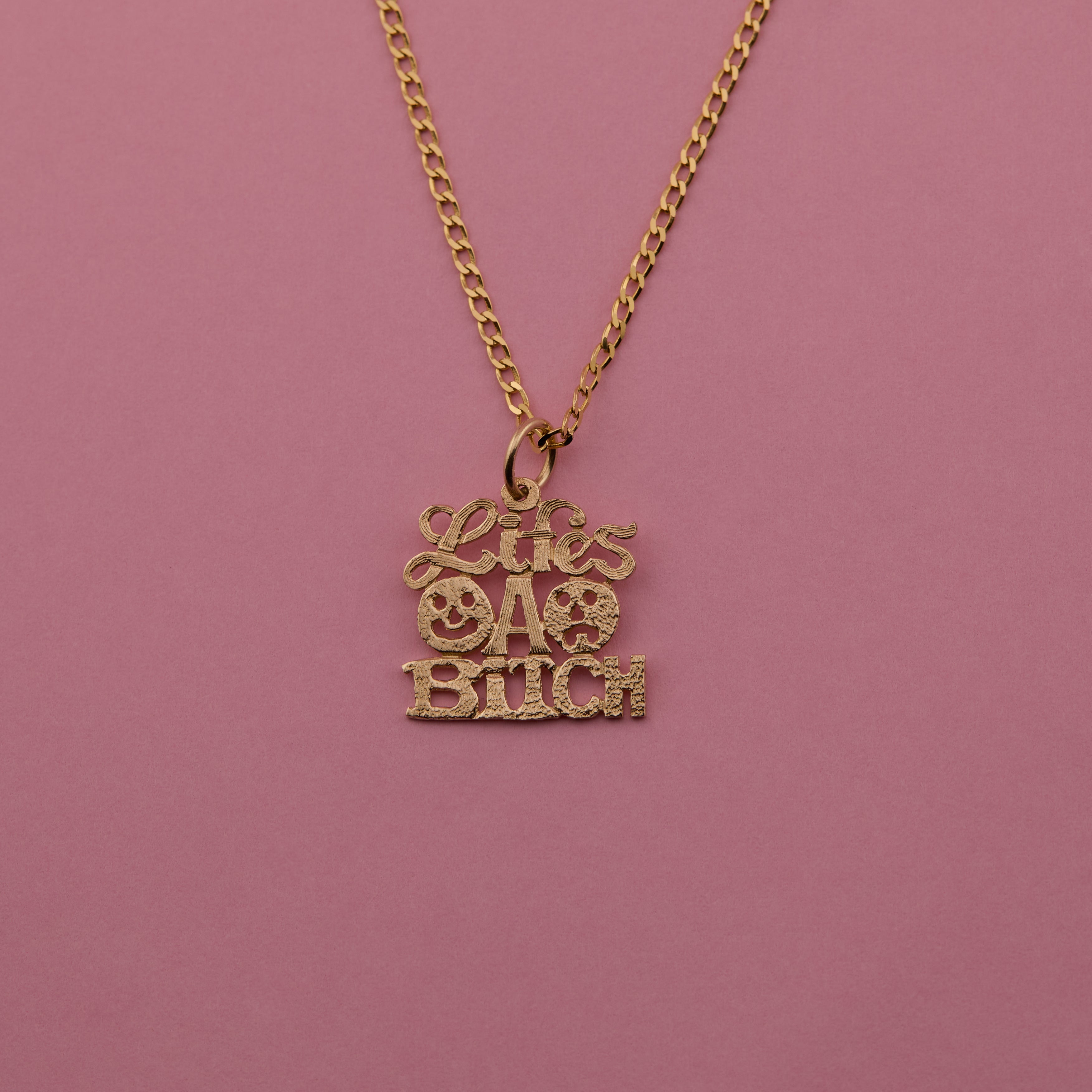 'Life's a Bitch' Charm