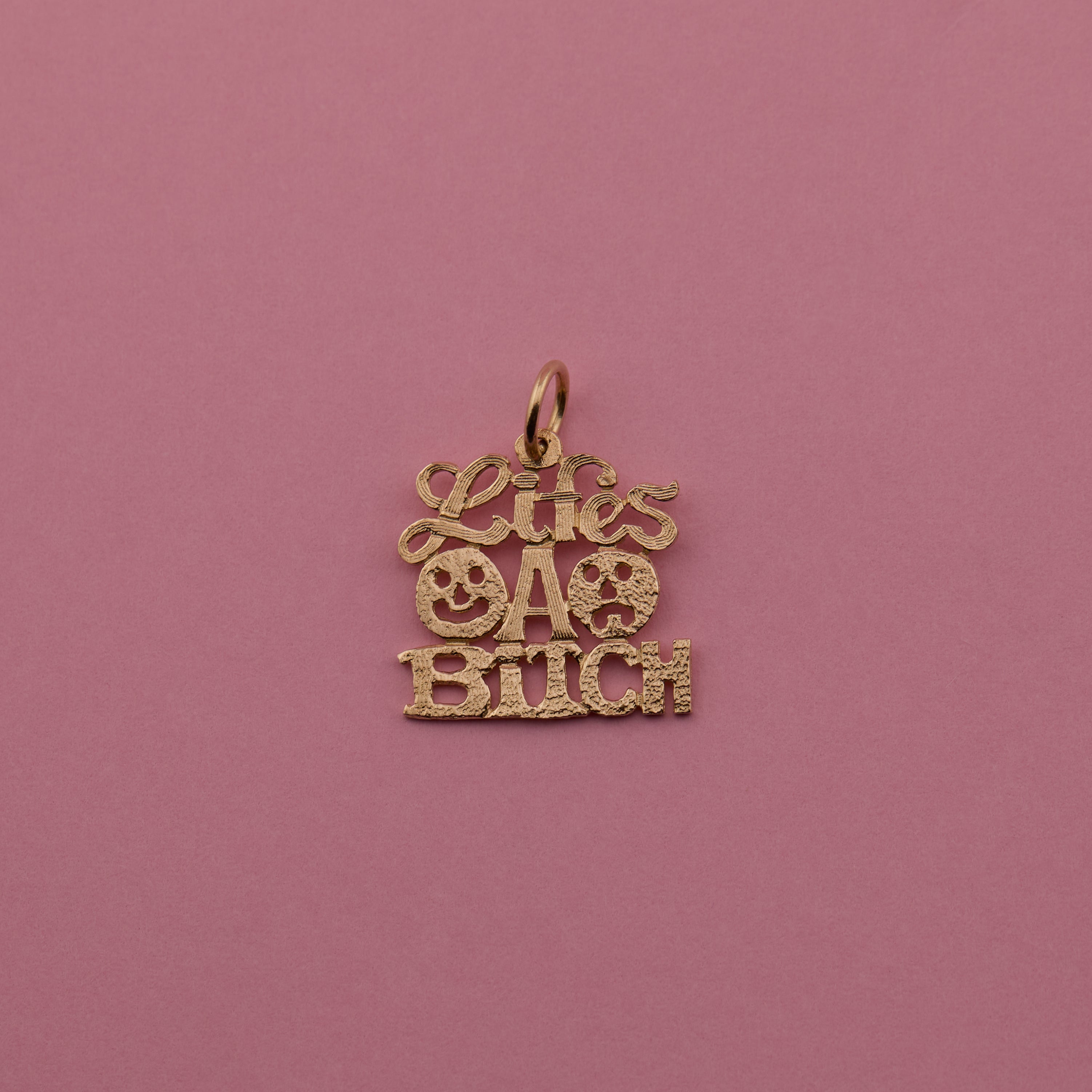 'Life's a Bitch' Charm